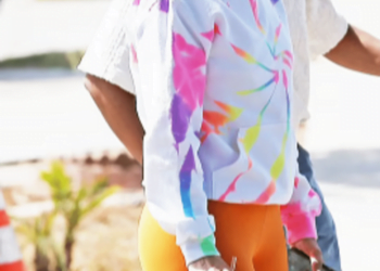 Jennifer Lopez wears orange leggings to show her love for fun colors