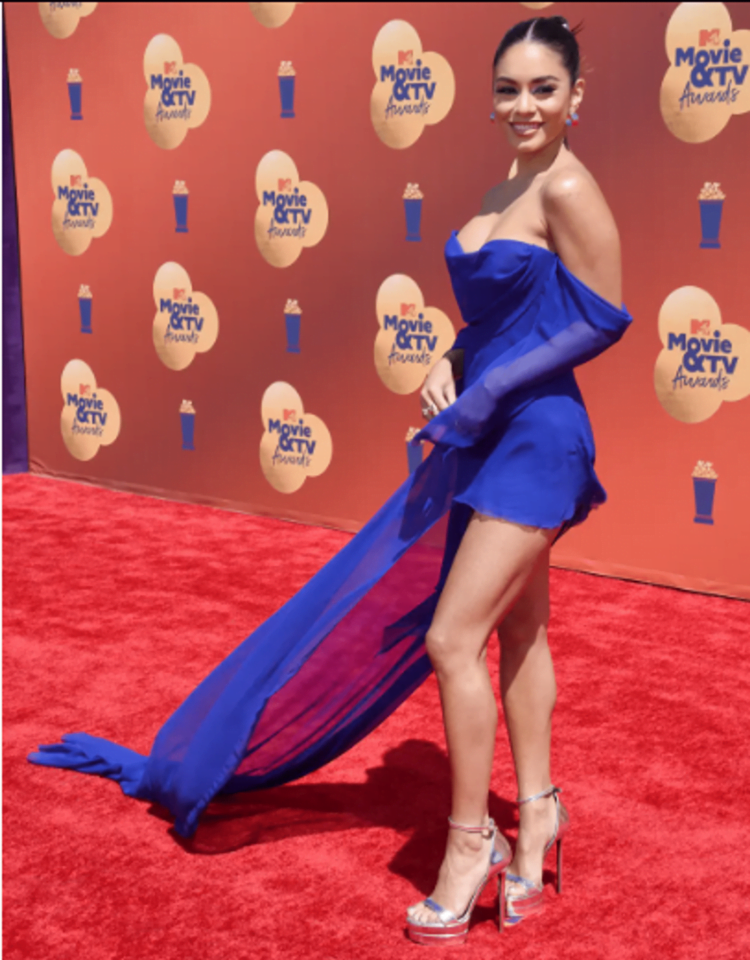 Vanessa Hudgens wears an electric blue dress with a flowing train and other guests at the MTV Movie & TV Awards 2022