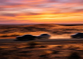 Conceptual abstract art of a desert road chase.