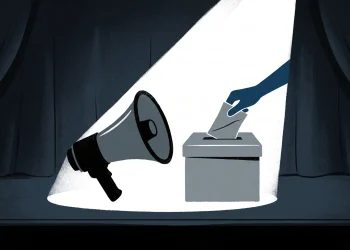 Conceptual illustration of a megaphone and ballot box under a spotlight.