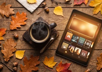 A cozy autumn setup with coffee and a tablet representing fall streaming content.