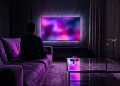 Conceptual image of a dimly lit modern living room with atmospheric television lighting.