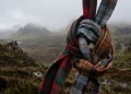 Conceptual image of intertwined tartan ribbons in the Scottish highlands.