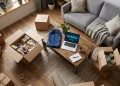 Conceptual image of moving boxes and religious items in a modern living room