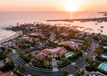 Aerial view of luxury mansions in Orange County at sunset.