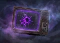 A cracked retro television set glowing with purple light in a dark environment.