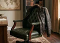 A leather flight jacket and a luxury office chair representing different film roles.