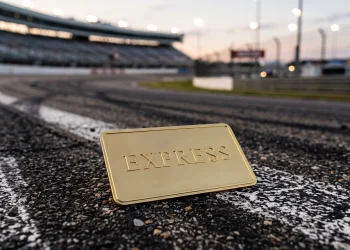 A conceptual gold express pass card on a racing track.
