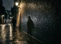 A conceptual atmospheric shot of a shadowy London alleyway.